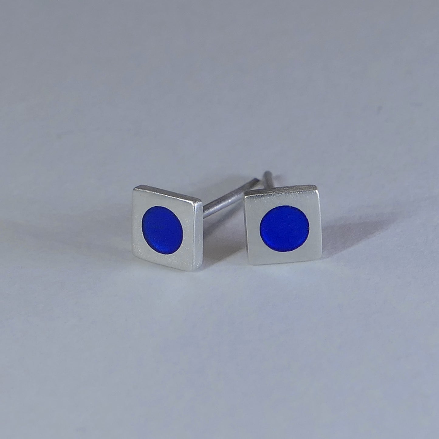 Tiny sterling silver square stud earrings, mid-blue