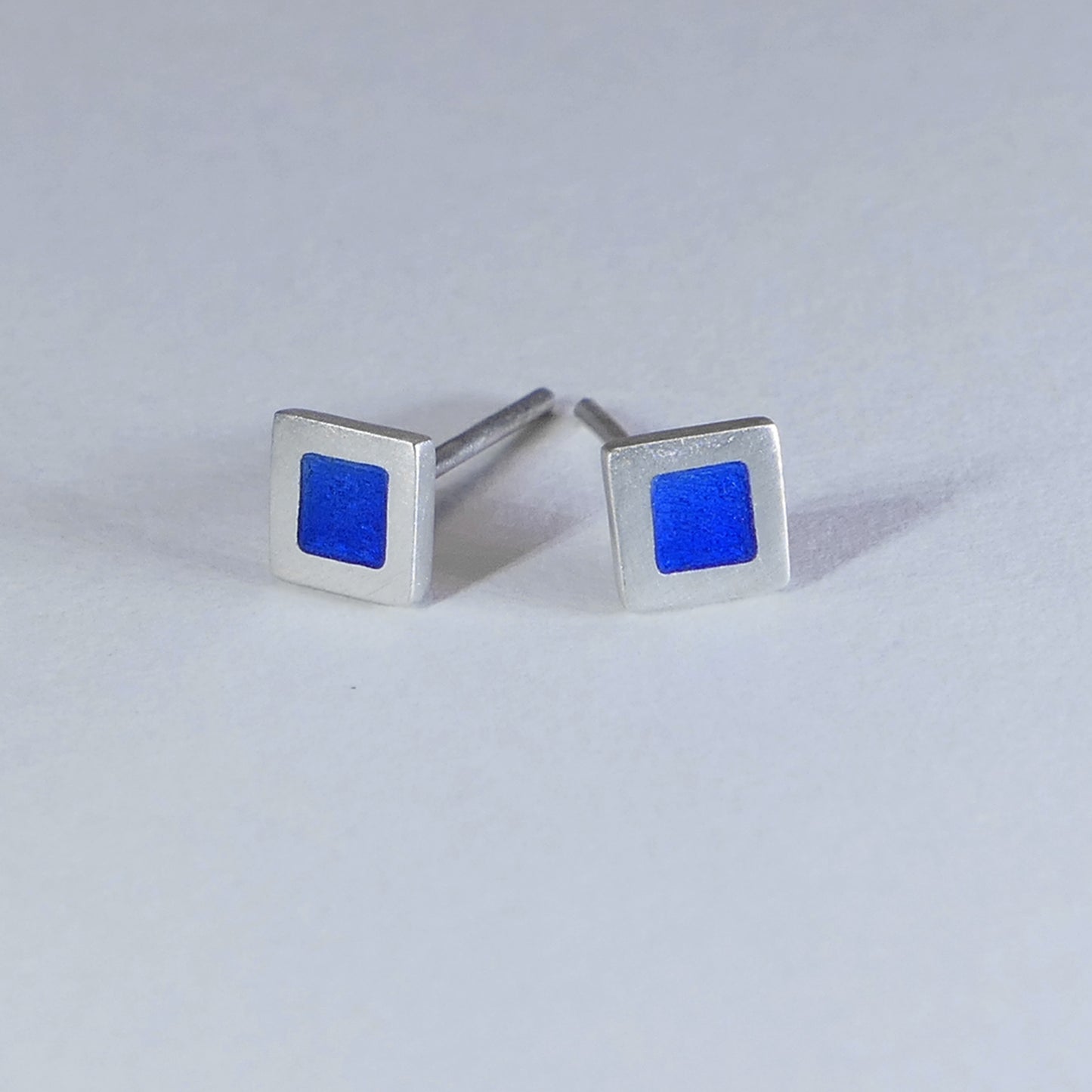 Tiny sterling silver square stud earrings, mid-blue