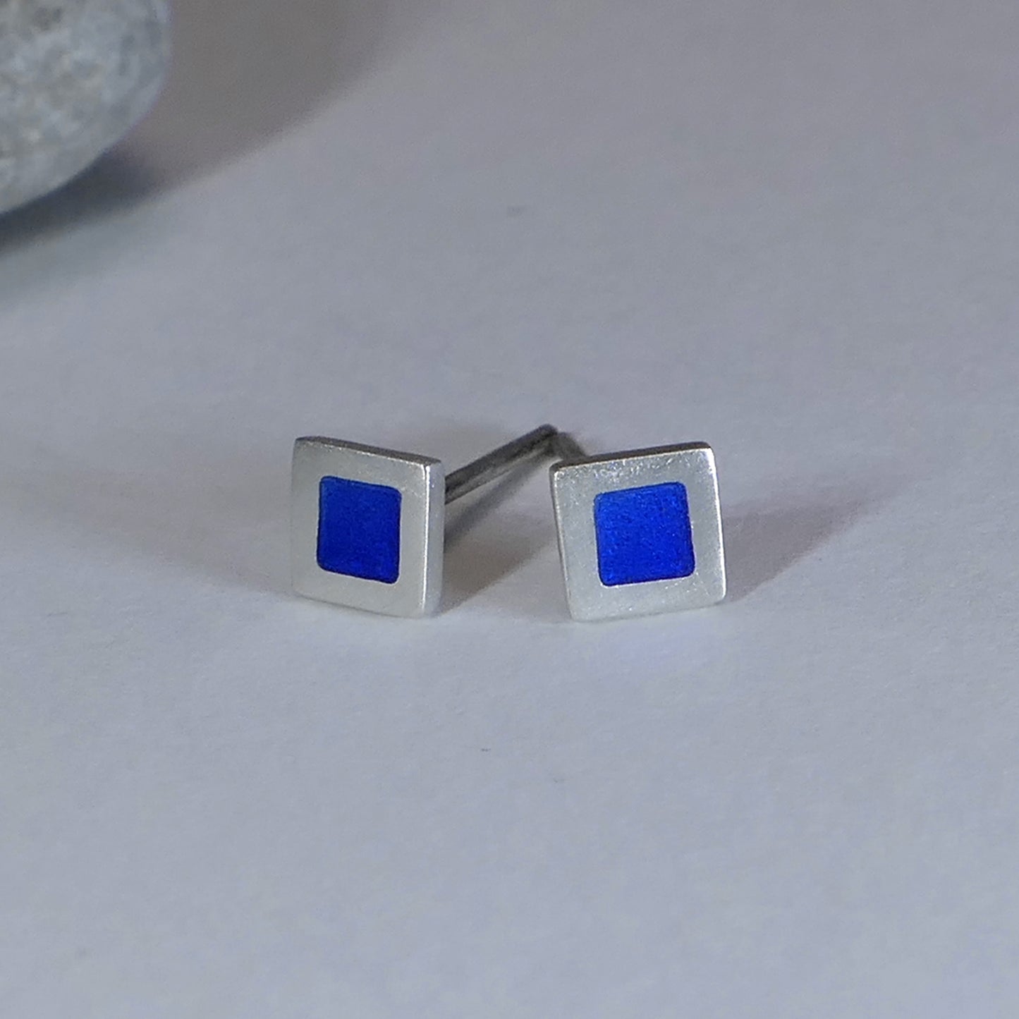 Tiny sterling silver square stud earrings, mid-blue